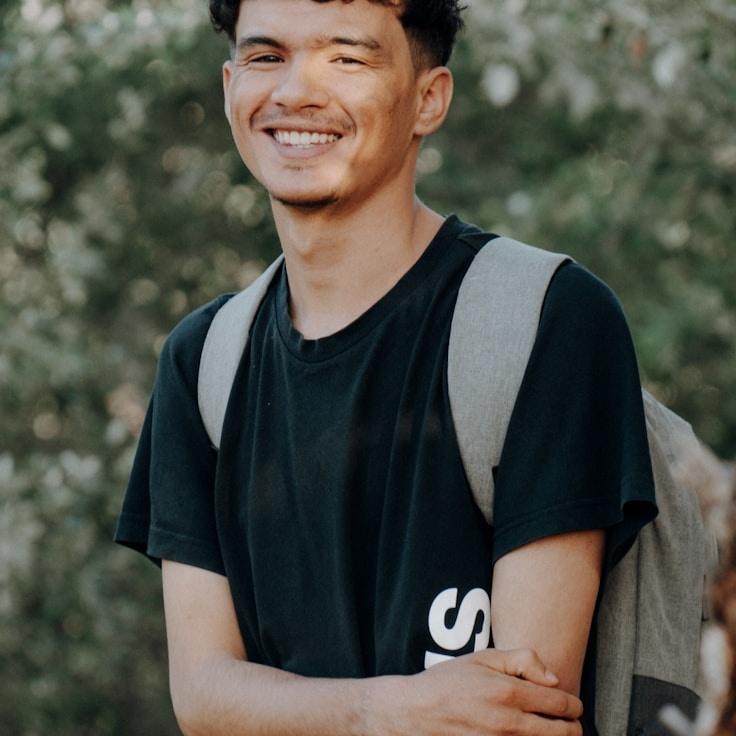 Ariya Singh, Lead Design Curator at Simple Grove Path, reviewing corporate floral arrangements